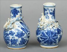 A pair of 19th century Chinese blue and white vases Each with stylised floral decoration and