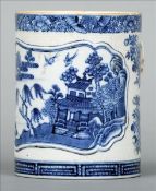 An 18th/19th century Chinese Export blue and white mug Decorated with a central vignette of a