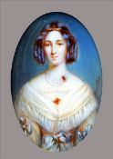 A 19th century portrait miniature on ivory Of a young lady wearing a decollete dress with her hair