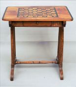 A 19th century and later inlaid walnut games table The rounded rectangular crossbanded top centred