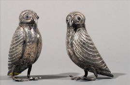 A pair of 19th century white metal pepperets, possibly Indian Each formed as a hawk with agate inset