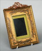 A late 19th/early 20th century yellow metal mounted and paste set gilt metal photograph frame Bow
