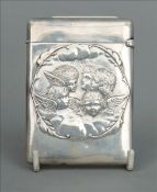 A Victorian silver card case, hallmarked London 1897, maker`s mark of WC Embossed to either side