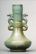 A Chinese pottery twin handled vase With allover grey glaze. 21 cms high. Generally in good
