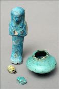 An Egyptian faience blue glazed shabti figure Together with a small similarly glazed cosmetic pot;