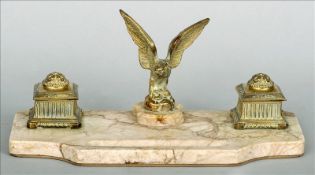 A 19th century marble desk stand The shaped base incorporating a pen tray surmounted with a cast