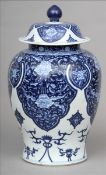A Chinese blue and white porcelain vase and cover Of baluster form, decorated with lotus strapwork