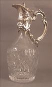 A modern silver mounted claret jug, hallmarked 925 The neck, handle and hinged cover floral and C-