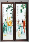A pair of Chinese porcelain panels. Painted with figures beneath pine trees, inscribed and with
