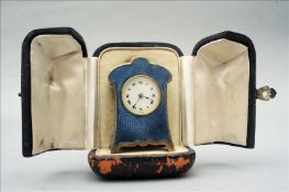 An Art Nouveau style blue guilloche enamel decorated miniature carriage clock The enamel dial with