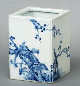 A Chinese blue and white porcelain brush pot Of square section with inverted corners, decorated in