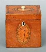 A George III satinwood tea caddy The finial mounted hinged lid inlaid with shell patera above a
