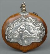 A 19th century Continental white metal mounted burrwood flask and stopper Embossed with the figure