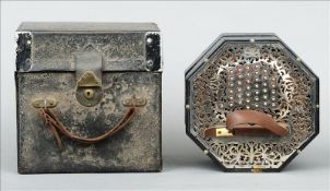 A cased G. Wheatstone & Co. 68 button concertina The sides with scrolling pierced white metal