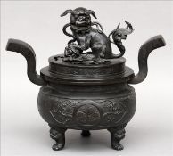 A 19th century Chinese patinated bronze censor The pierced lid with a dog-of-fo finial above two