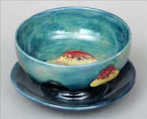 An early 20th century William Moorcroft Claremont Toadstool pattern bowl The green ground bowl