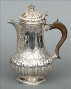 A 19th century Maltese silver coffee pot The body of baluster form with embossed and chased