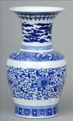 A Chinese blue and white porcelain vase Of baluster form with flared rim decorated with lotus