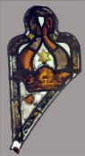 A pair of antique leaded stained glass panels, possibly 15th century Each decorated with a crown,