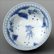 A Chinese porcelain blue and white bowl The interior decorated with stylised goldfish, the