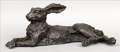 A bronze model of a recumbent hare Modelled naturalistically. 68 cms wide. Overall good.