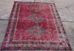 A Shiraz wool rug 292 x 193 cms.