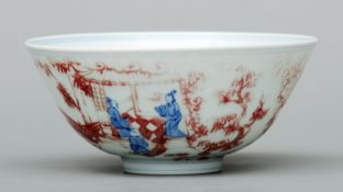 A Chinese porcelain bowl Decorated in blue and red with figures in interiors, the underside with