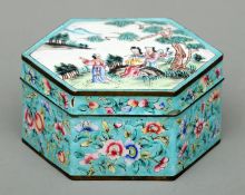 A Cantonese enamel decorated box Of hexagonal form, the lid decorated with figures in a landscape,