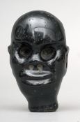 An African carved hardstone head 12 cms high.Overall good, some slight chipping and wear.