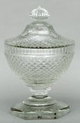 A 19th century cut glass pedestal bowl and cover Diamond relief cut overall, standing on a hexagonal