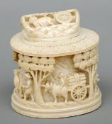 A late 19th/early 20th century Indian carved ivory box and cover Decorated in the round with