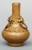 A small 19th century Chinese crackle glazed vase The slender neck issuing twin gilded lion mask