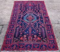 A Hamadan wool rug 297 x 130 cms.