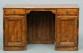 A 19th century Continental painted pine desk The rounded rectangular top above two drawers and two