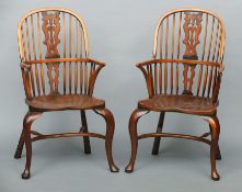 A set of eight 20th century elm seated Windsor chairs Each with a curved top rail above a pierced