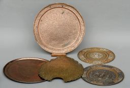 Two Indian mixed metal circular plaques, an Indian brass plaque and a finely engraved circular