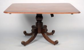 A 19th century mahogany tilt-top breakfast table The rounded rectangular top above a bulbous