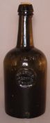 An 18th/19th century blown green glass bottle With impressed medallion for Herader & Company,