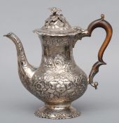 A George II silver coffee pot, hallmarked London 1750, maker’s mark of G.M Of baluster form, the