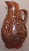 A 19th century stoneware wine jug Of baluster form, the body with applied fruiting vine sprigs,