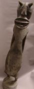 A 19th/20th century carved African tribal figure Stylistically modelled with allover chip carved