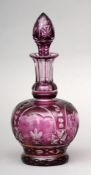A Stevens & Williams intaglio cut cameo decanter and stopper Amethyst overlaid. 27.5 cms high