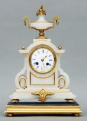 A 19th century gilt metal mounted alabaster mantel clock The urn form finial above an enamelled dial