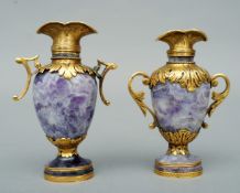 A matched pair of yellow metal (tests as 18 ct gold) mounted carved fluorite mineral vases Each with