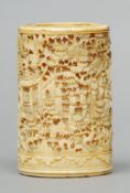 A 19th century Cantonese carved ivory brush pot The cylindrical body profusely carved with figures