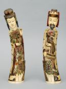 A pair of Oriental carved ivory figures Each with detachable heads and will allover painted