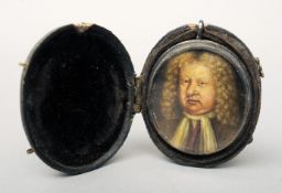 A 17th/18th century portrait miniature of a gentleman In white metal frame, with suspension loop and