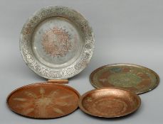 A large tinned copper circular dish With engraved calligraphic decoration; and three copper circular