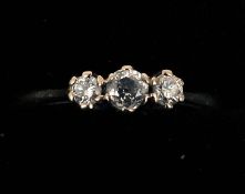 An 18 ct gold three stone diamond ring