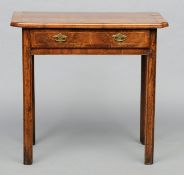 An 18th century walnut side table The crossbanded canted rectangular top above a single frieze